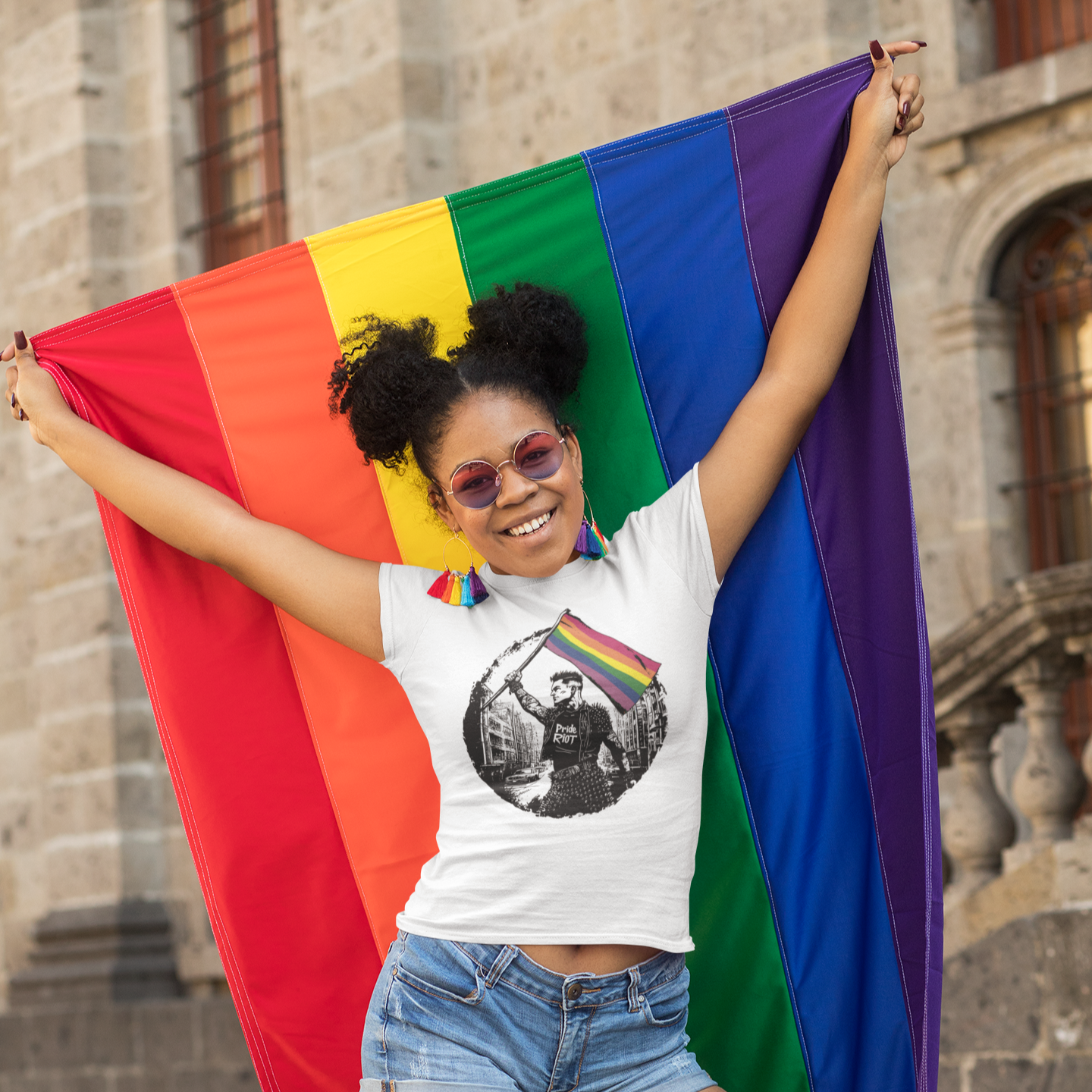 Riot Flagbearer Tee – Queer Punk Protest Shirt – Unisex LGBTQ+ 2025 Pride Graphic by Pride Riot