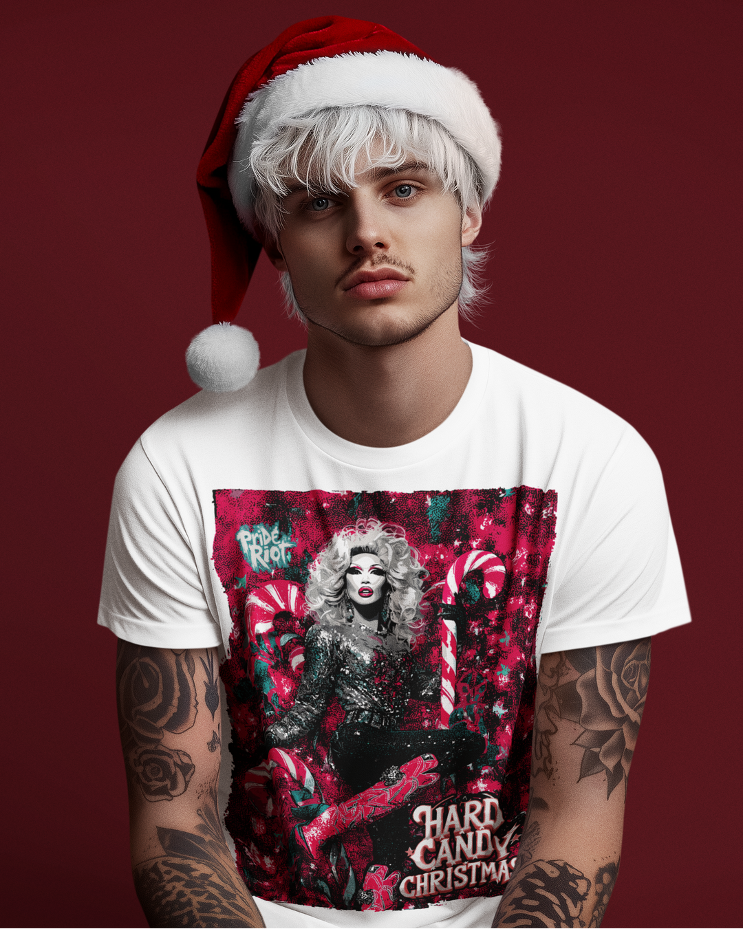 Man wearing a white Pride Riot holiday tee shirt