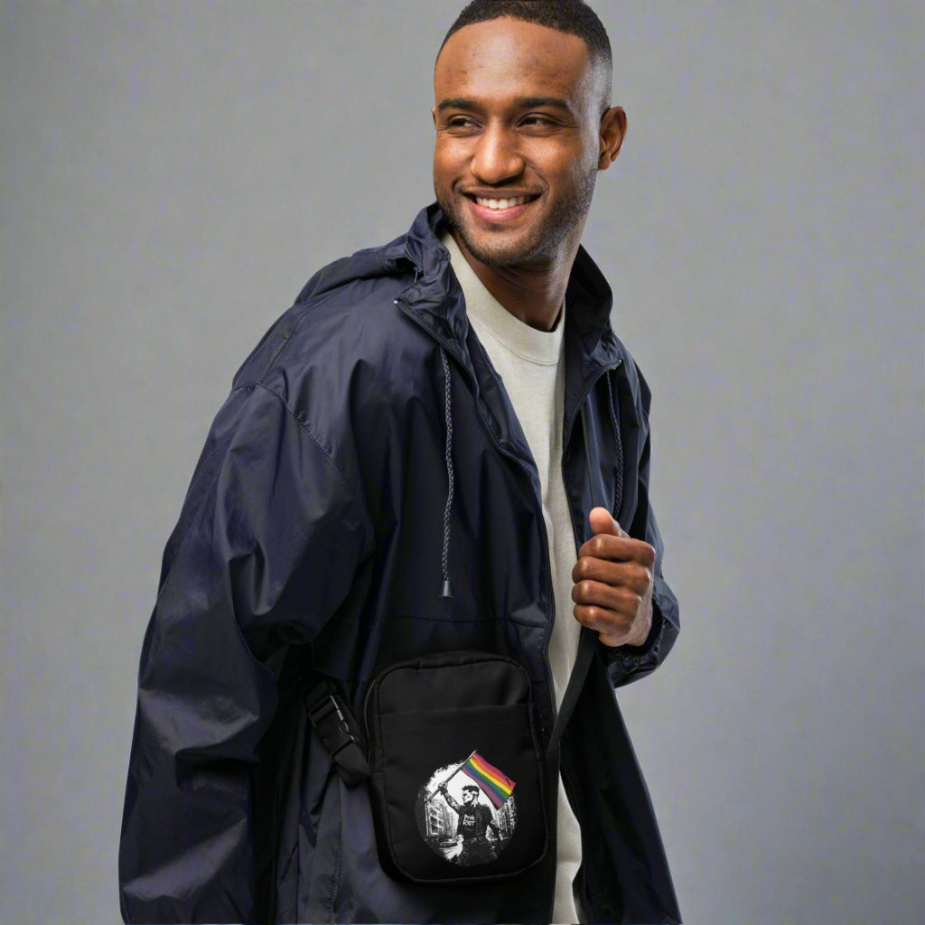 Man wearing a navy blue jacket with a front pocket on a white background