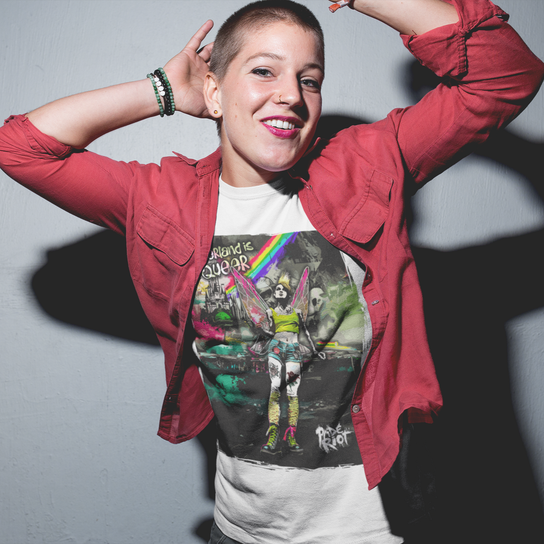 Person wearing a red jacket over a graphic t-shirt with a colorful design, standing against a plain background.