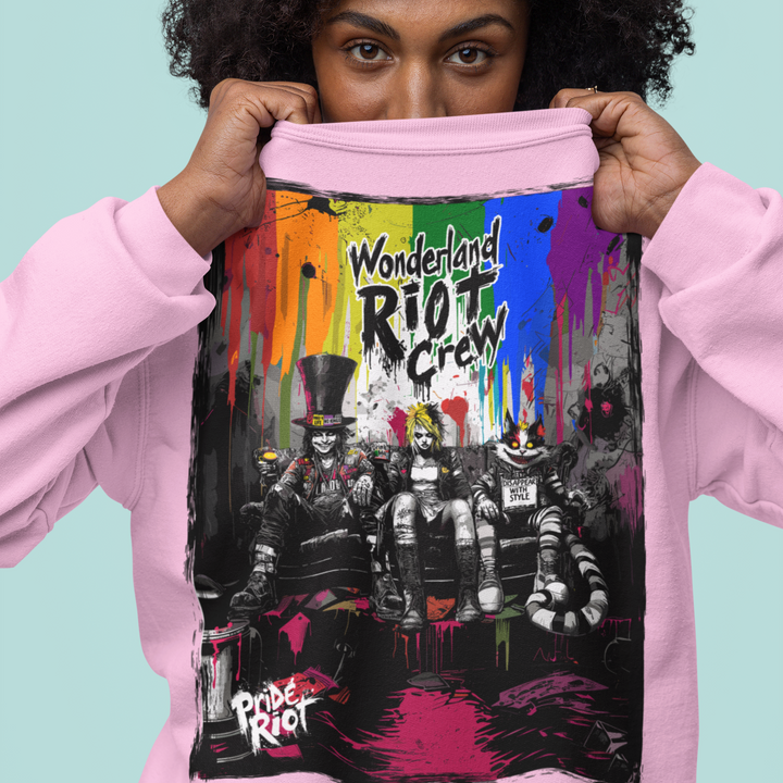 Front view of the Alice in Anarchy standard crewneck sweatshirt in Light Pink. The chest features the distorted punk Alice graphic in bright neon and white ink.