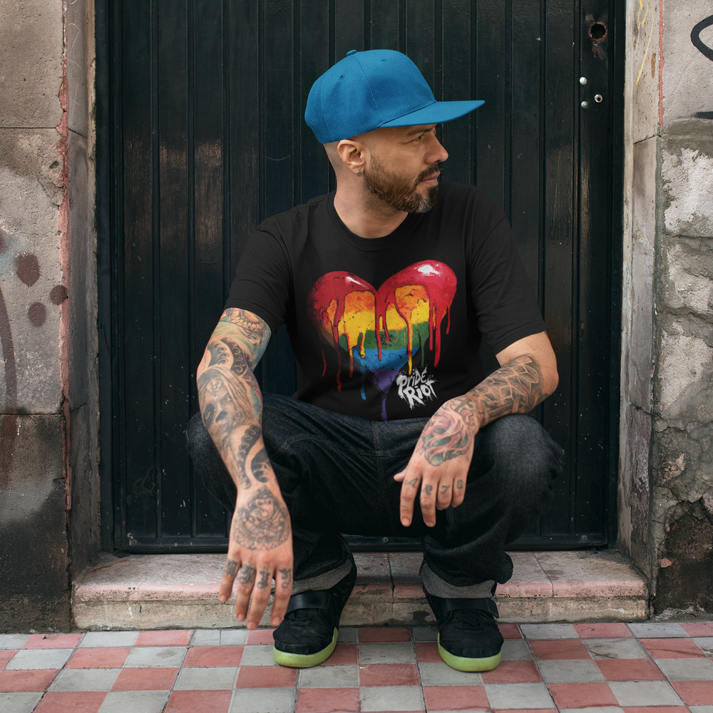 Bleeding Heart tee in black, worn — a dripping rainbow heart with the Pride Riot logo