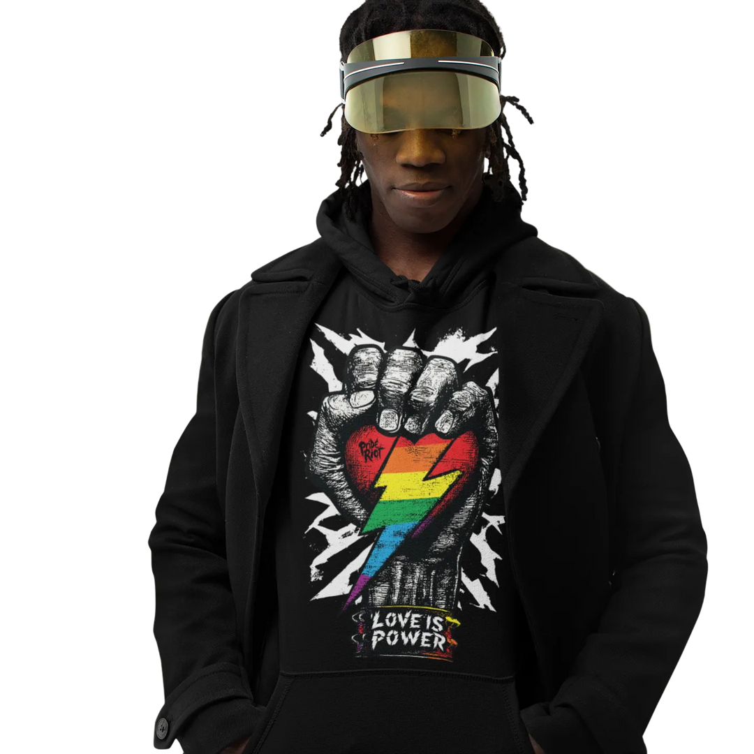 Love is Power (Dark) hoodie worn by a model, black — raised fist with a rainbow lightning bolt — Pride Riot