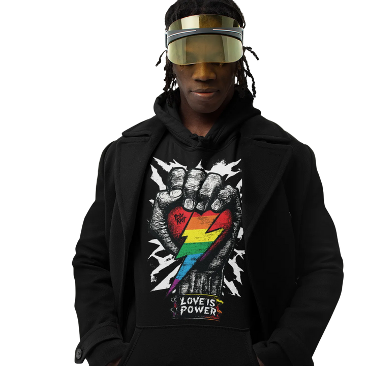 Love is Power (Dark) hoodie worn by a model, black — raised fist with a rainbow lightning bolt — Pride Riot