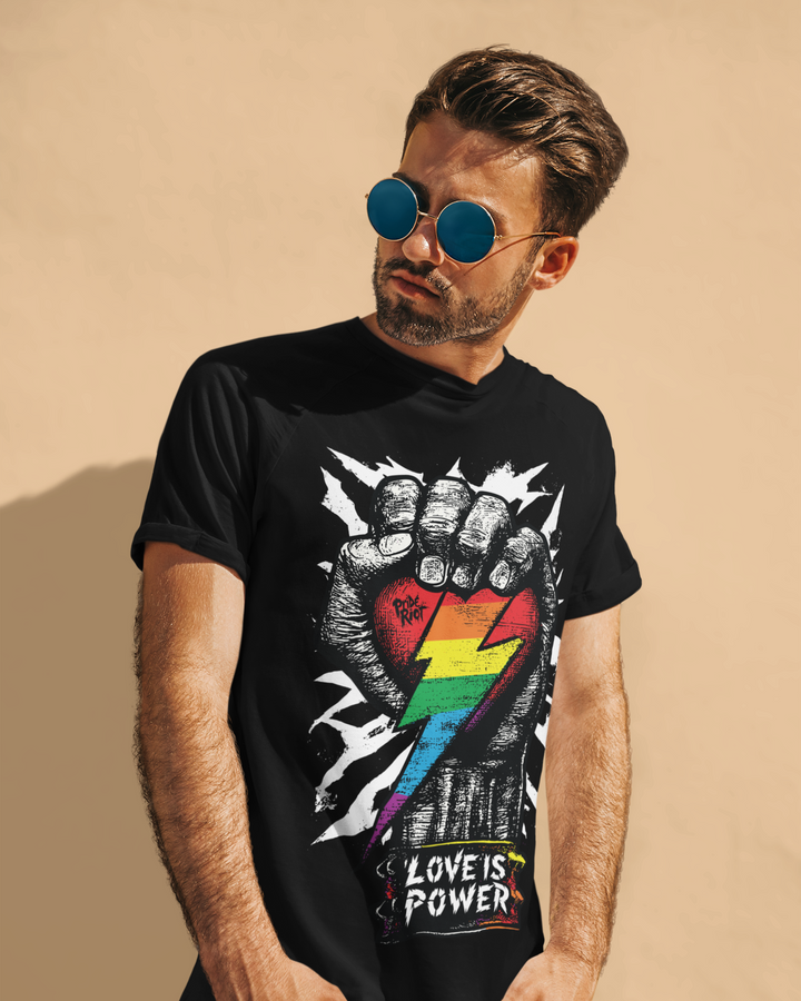 Love is Power (Dark) tee worn by a model, black — rainbow pride design with LOVE IS POWER — Pride Riot