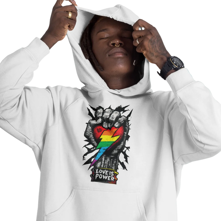 Love is Power (Light) hoodie worn by a model, white — fist breaking through a rainbow heart with LOVE IS POWER on two lines — Pride Riot