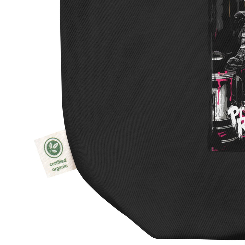 Close-up of the organic cotton canvas texture and the reinforced stitching on the handle. The fabric looks thick and durable, highlighting the quality construction.