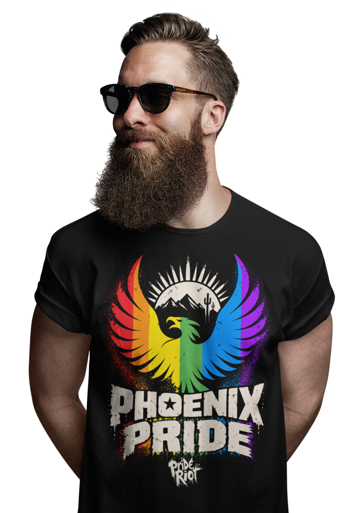 PHX Pride tee in black, worn, front — rainbow phoenix rising over the desert, Pride Riot®
