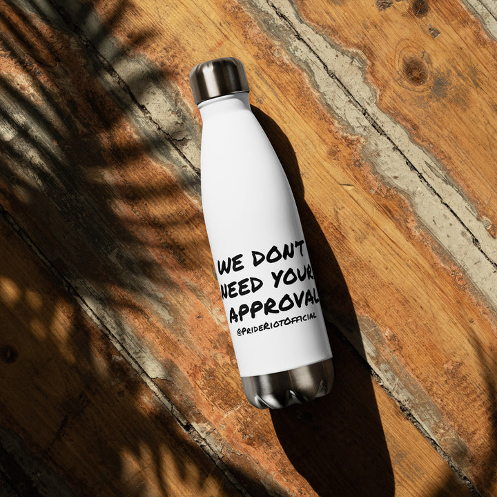 White water bottle with black text on a wooden surface
