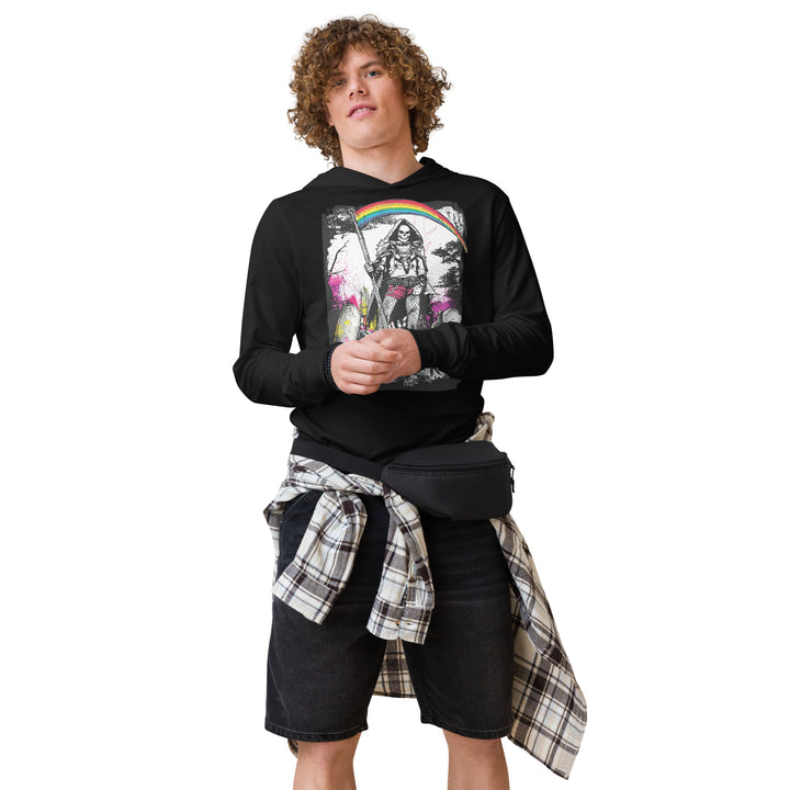 Person wearing a black sweatshirt with a graphic design, plaid shirt over shorts, and black waist bag on a white background