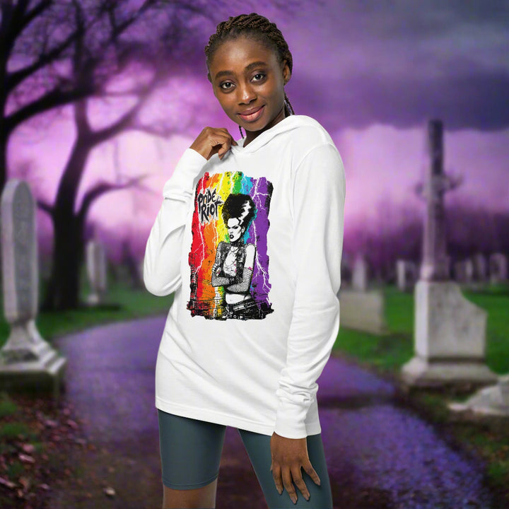 Person wearing a white hoodie with a colorful graphic design